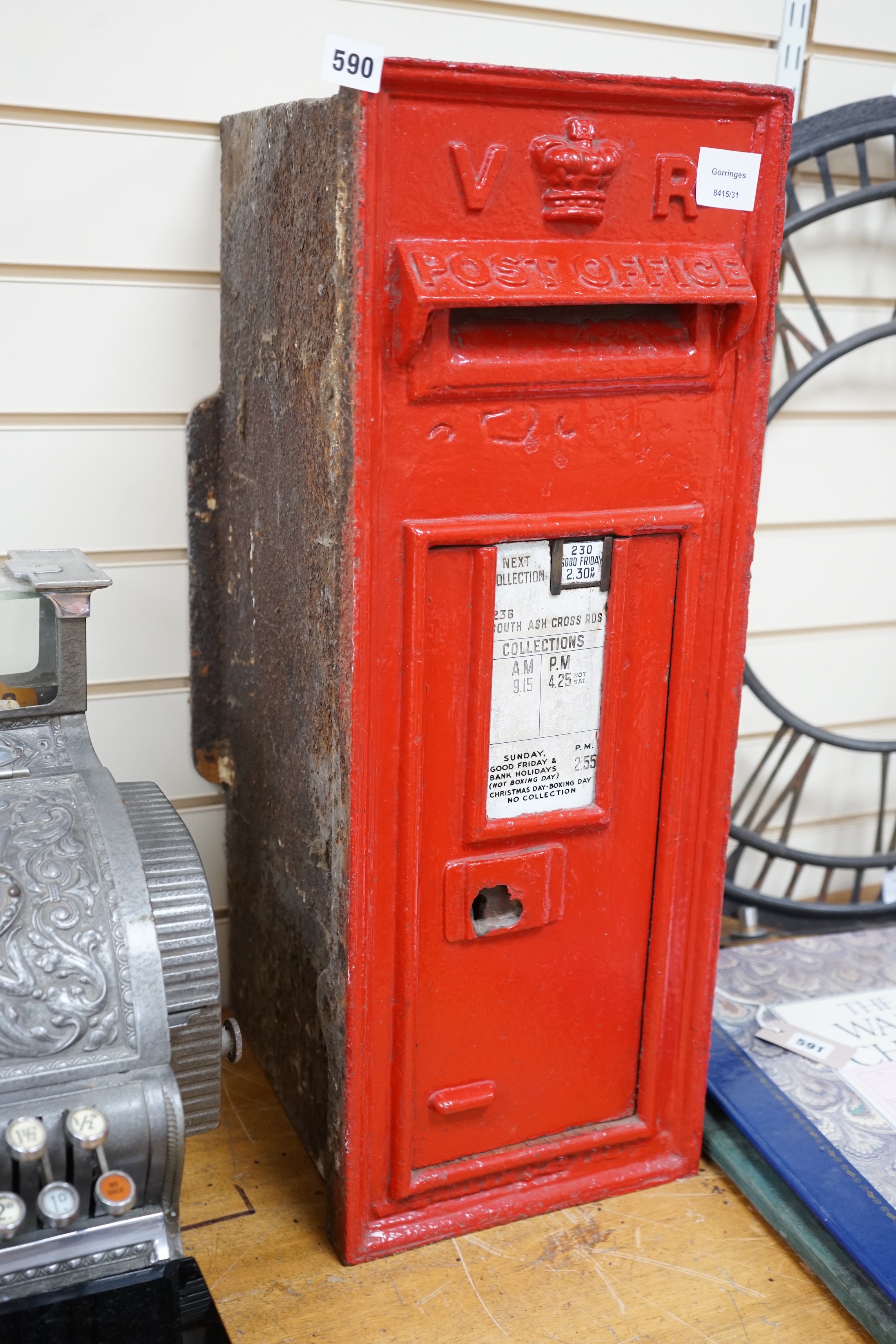 A Victorian red painted cast iron wall mounted post box, 72cm tall